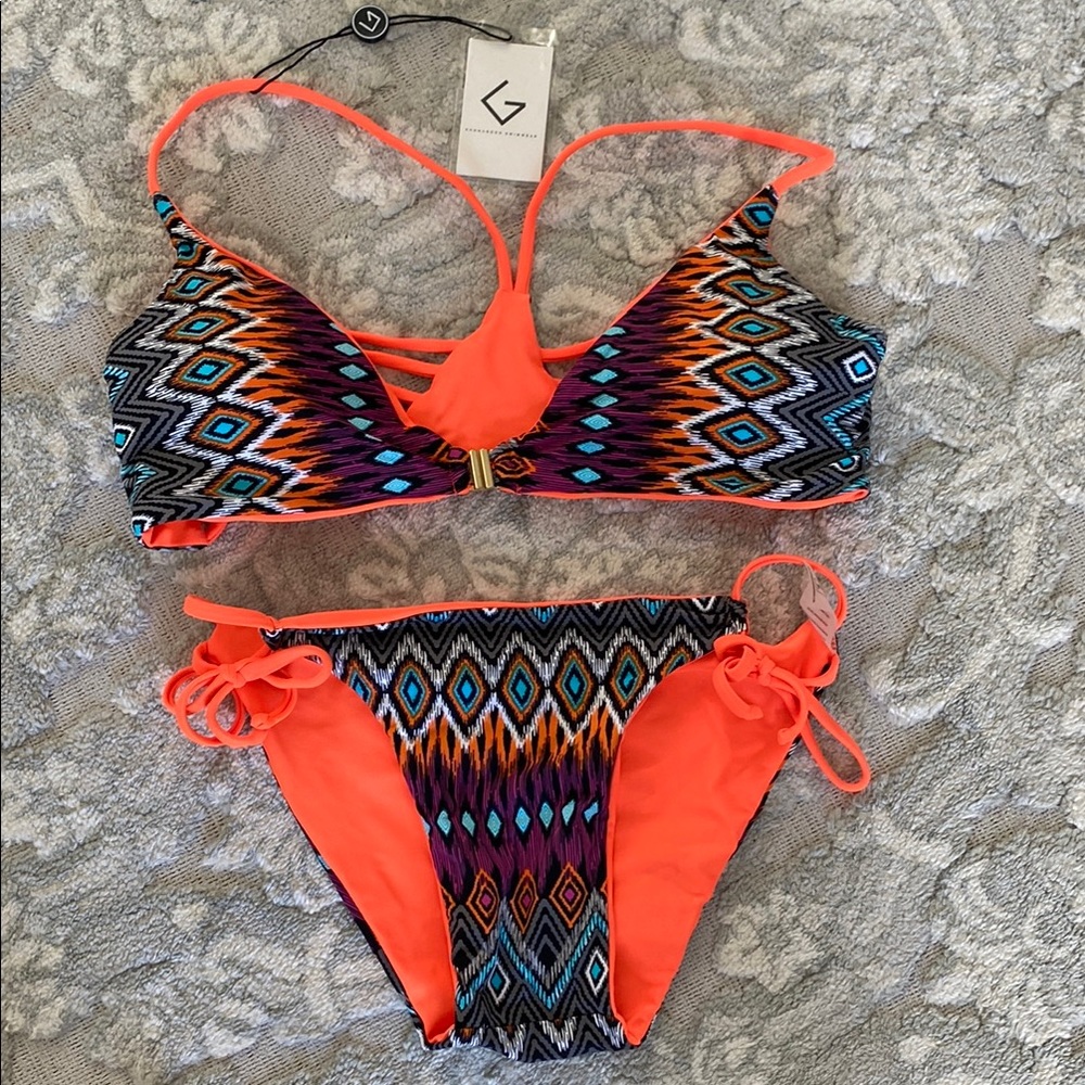 Khongboon Reversible Geometric Bikini Set in orange/blue/black/purple. Size L